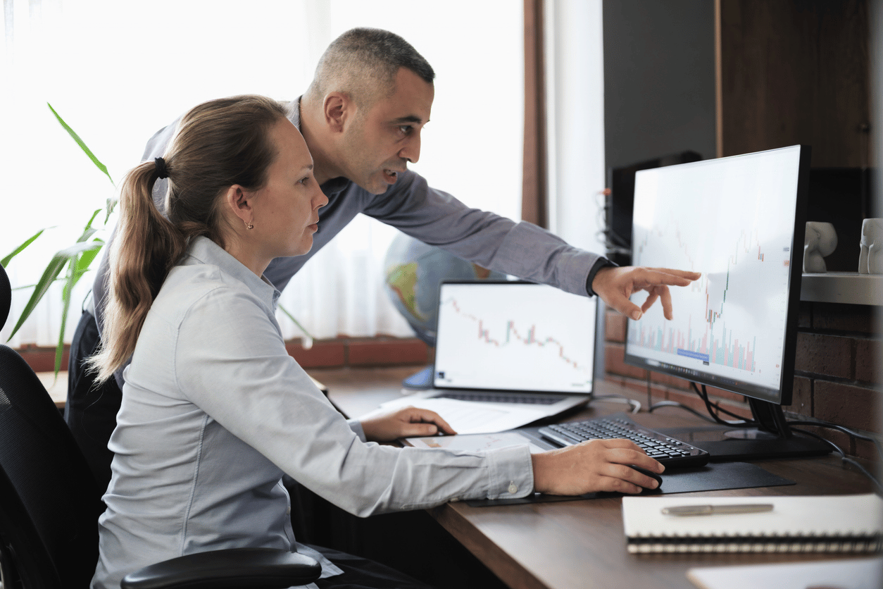 Employees looking at a computer Employees looking at a computer